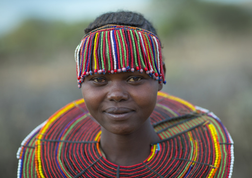 A pokot woman wears large necklaces made from the stems of sedge grass, Baringo county, Baringo, Kenya
