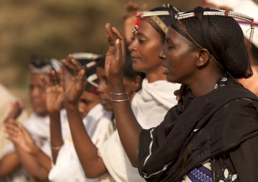 Gabbra tribe women dancing with traditional headgear, Chalbi desert, Kalacha, Kenya