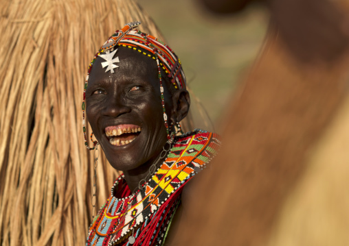 Portrait of a laughing El Molo tribe woman, Rift Valley Province, Turkana lake, Kenya