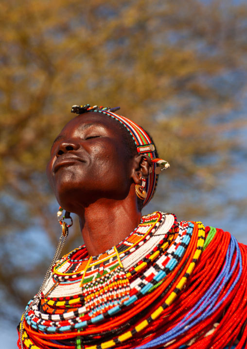 Samburu tribe woman with beaded necklaces dancing, Samburu County, Maralal, Kenya