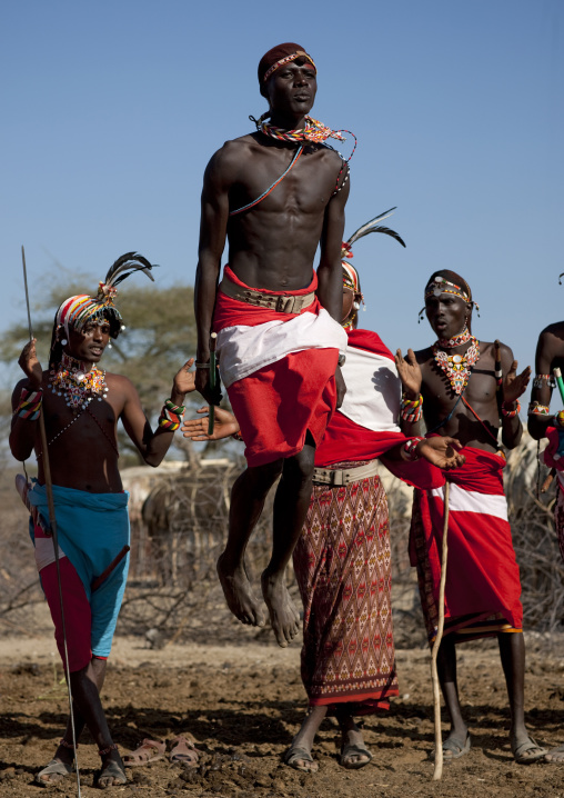 Samburu tribe warriors jumping during a ceremony, Samburu County, Maralal, Kenya