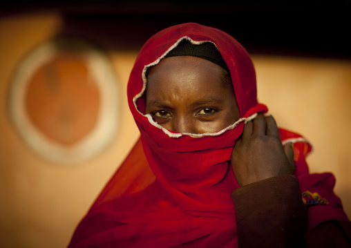 Portrait of a muslim Borana tribe woman hiding her face with a veil, Marsabit County, Marsabit, Kenya