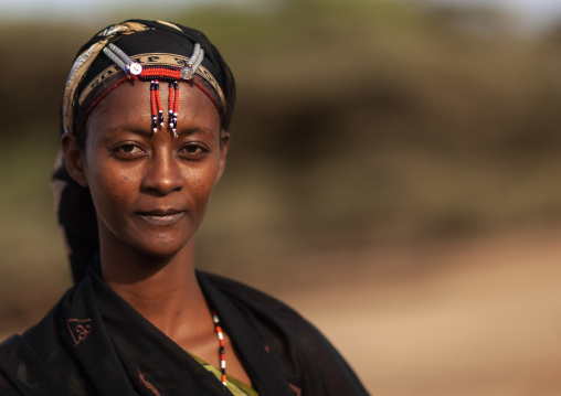 Portrait of a Gabra tribe woman wearing the traditional headwear, Marsabit County, Chalbi Desert, Kenya