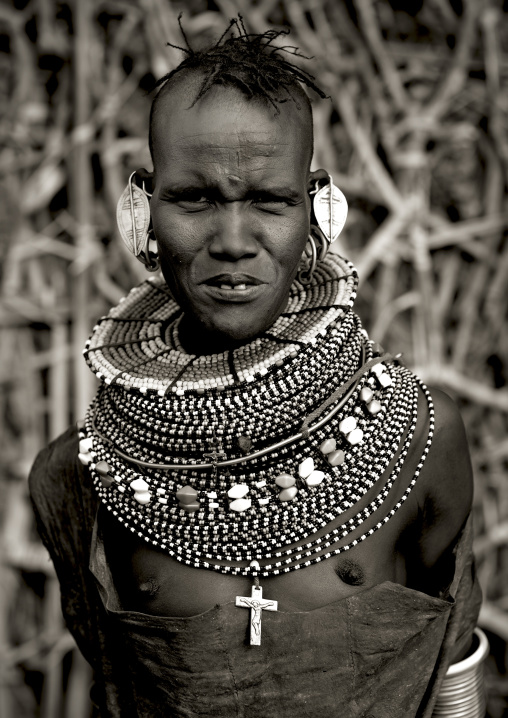 Portrait of a Turkana tribe woman with large earrings and necklaces, Rift Valley Province, Turkana lake, Kenya