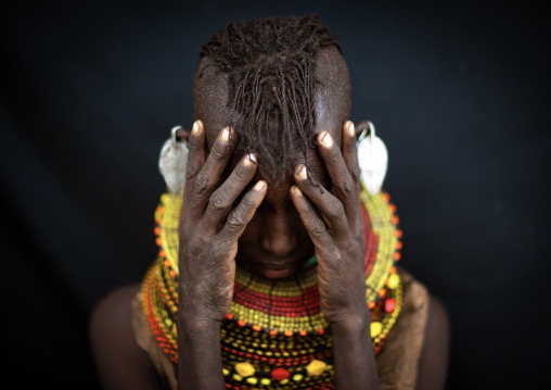 Turkana tribe woman hiding her face, Rift Valley Province, Turkana lake, Kenya