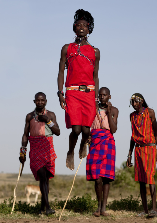 Maasai tribe men jumping during a ceremony, Rift Valley Province, Maasai Mara, Kenya