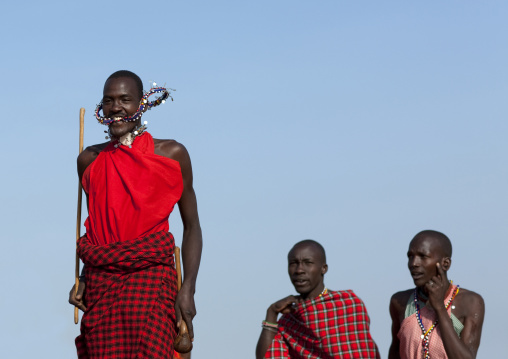 Maasai tribe men jumping during a ceremony, Rift Valley Province, Maasai Mara, Kenya