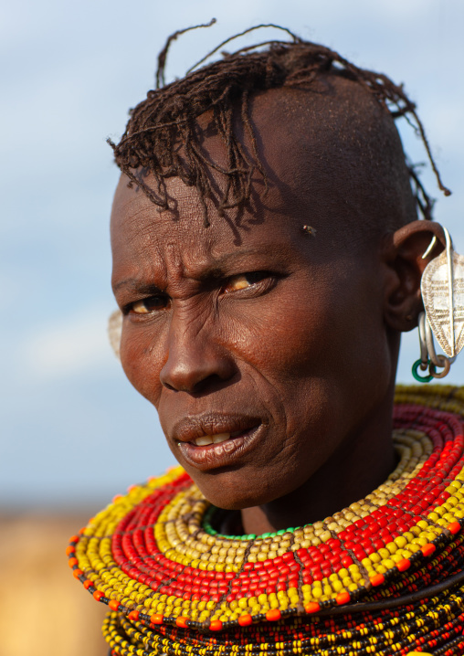 Portrait of a Turkana tribe woman with large earrings and necklaces, Rift Valley Province, Turkana lake, Kenya