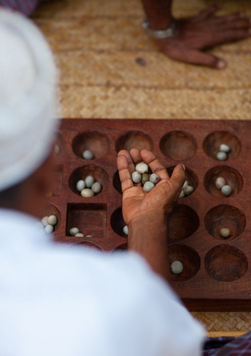 Players of bao in the street, Lamu County, Lamu, Kenya