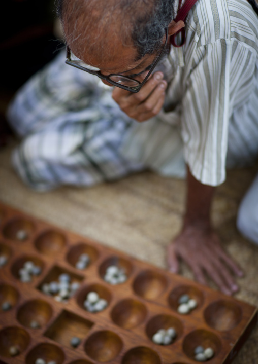 Players of bao in the street, Lamu County, Lamu, Kenya