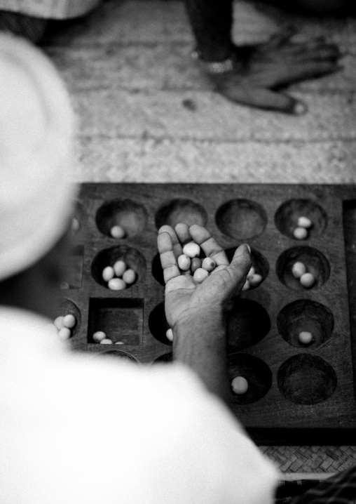 Players of bao in the street, Lamu County, Lamu, Kenya