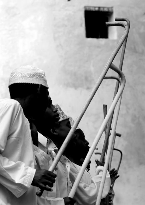 Muslim children dancing with sticks during Maulid festival, Lamu County, Lamu, Kenya