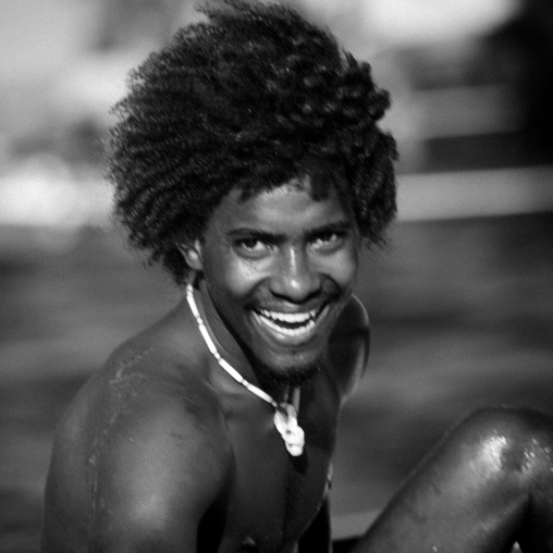 Man with hairy head smiling, Lamu County, Lamu, Kenya