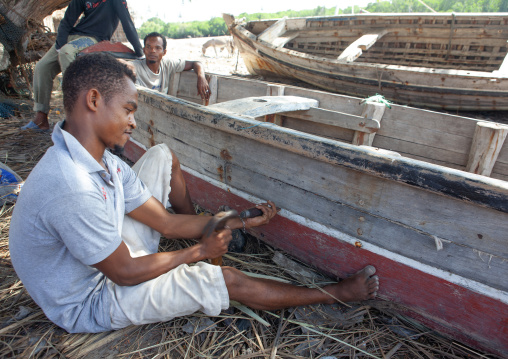 A shipbuilder working on a dhow, Lamu County, Matondoni, Kenya