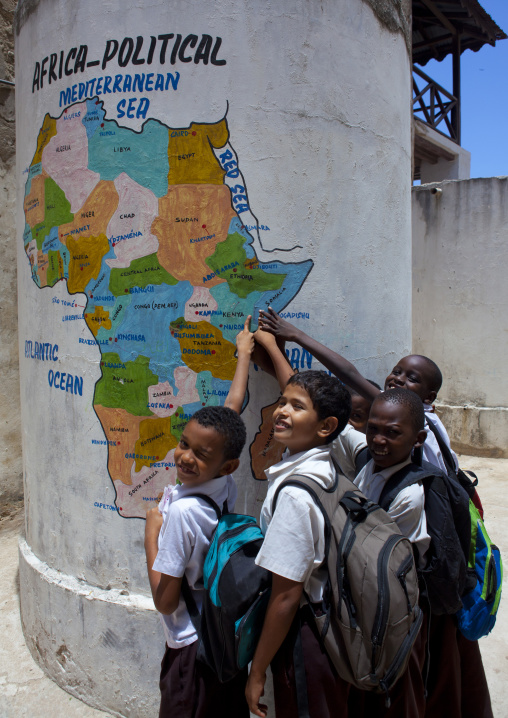 Group of pupils showing Lamu on painted map at school, Lamu County, Lamu, Kenya