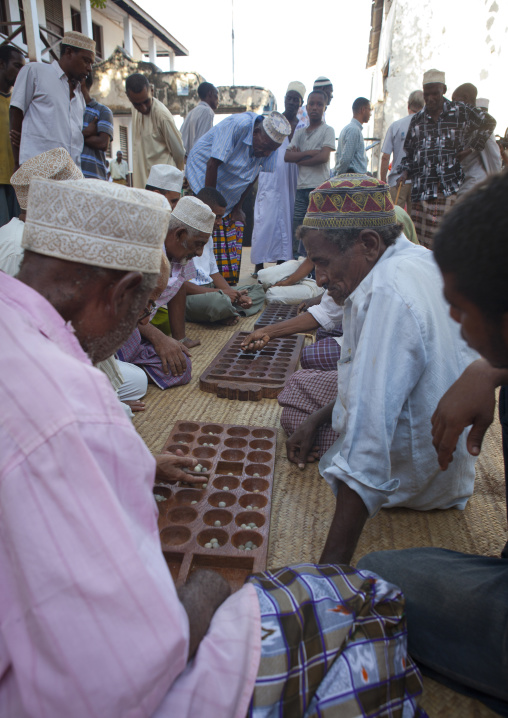 Players of bao in the street, Lamu County, Lamu, Kenya