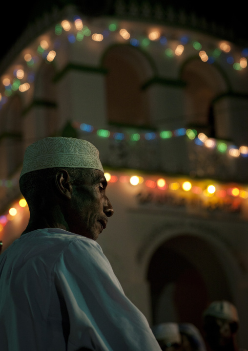 Muslim men singing and dancing with goma sticks during Maulid festival, Lamu County, Lamu, Kenya