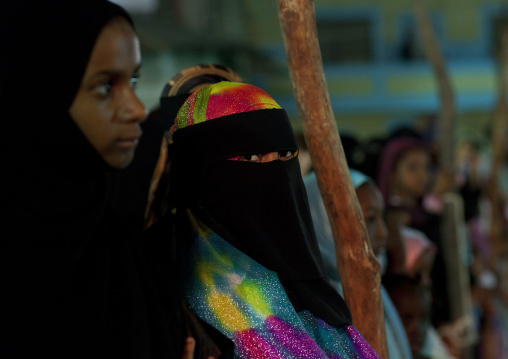 Woman wearing a colorful burqa in the street, Lamu County, Lamu, Kenya