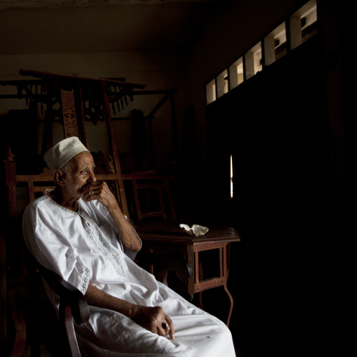 Old wood carver in his workshop, Lamu County, Lamu, Kenya
