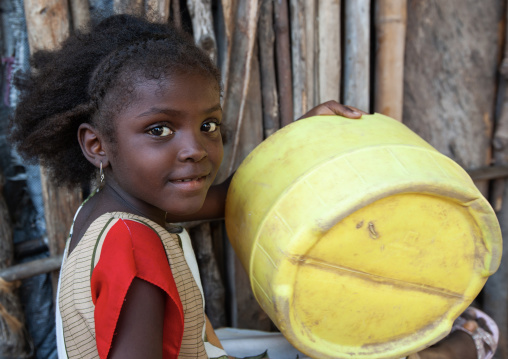 Young smiling girl with braids looking at camera, Lamu County, Lamu, Kenya
