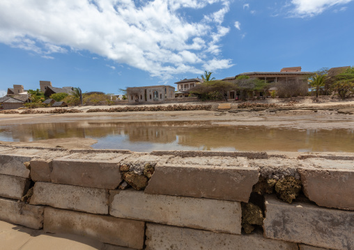 Beach erosion along the seashore at low tide, Lamu County, Manda Island, Kenya