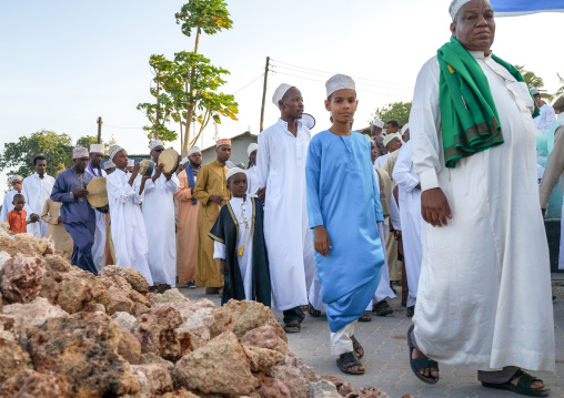 Sunni muslim people parading during the maulidi festivities in the street, Lamu county, Lamu town, Kenya