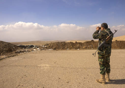 Kurdish Peshmerga Looking With Binoculars On The Frontline, Duhok, Kurdistan, Iraq