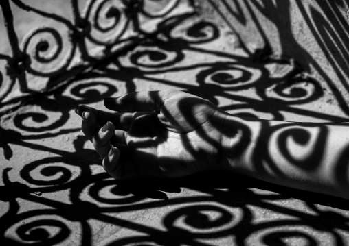 Woman Hand In The Shadow Of A Wrought Iron Window In The Citadel, Erbil, Kurdistan, Iraq