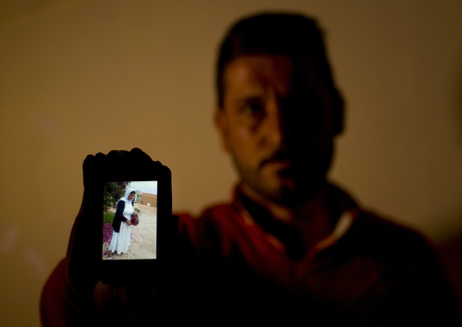 Yezedi Refugee From Sinjar Showing A Relative Killed By Daesh On His Mobile Phone, Zohar, Kurdistan, Iraq