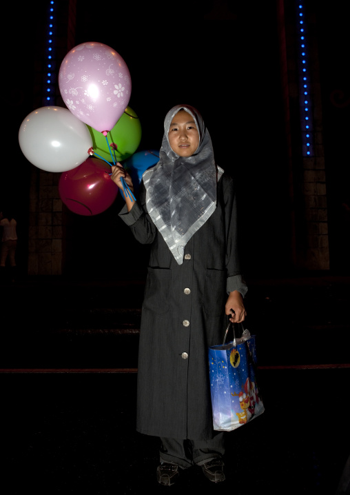 Veiled Woman Holding Balloons, Bishkek, Kyrgyzstan