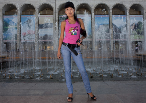 Muslim Woman Posing In Front Of A Fountain, Bishkek, Kyrgyzstan
