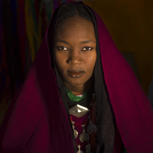 Portrait of a tuareg girl in traditionnal red clothing, Tripolitania, Ghadames, Libya
