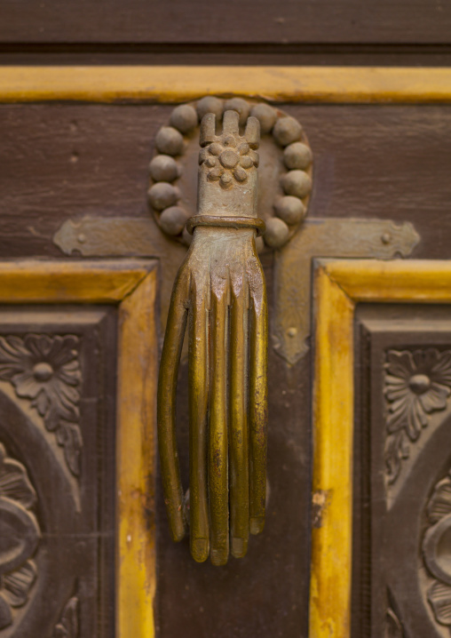 Old italian knocker with a human hand, Cyrenaica, Benghazi, Libya