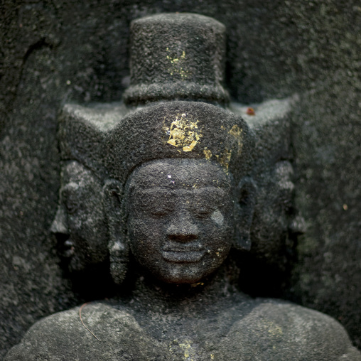 Statue guards temple at wat phu, Champasak, Laos