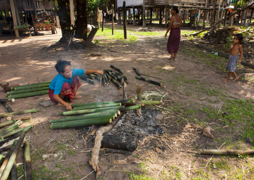 Bru minority woman making fire, Phonsaad, Laos