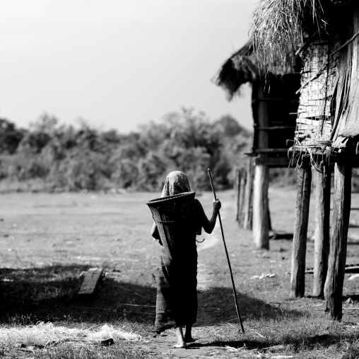 Bru minority woman carrying a basket on her back, Phonsaad, Laos