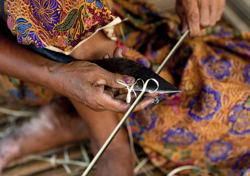 Bru minority woman cutting bamboos, Phonsaad, Laos