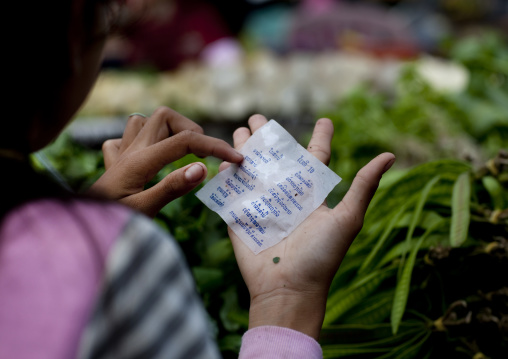 Woman reading predictions, Pakse, Laos