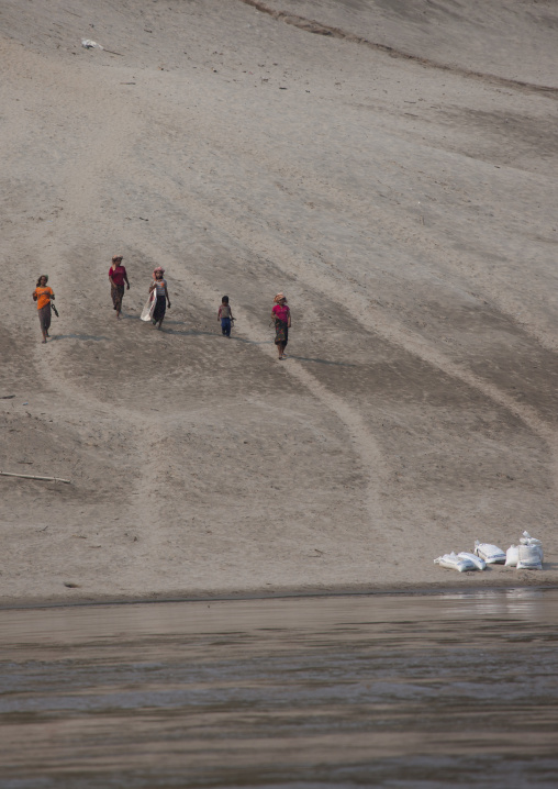 Laotian people on mekong river bank, Houei xay, Laos