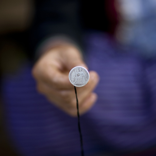Thai dam minority woman showing an old french coin, Muang sing, Laos