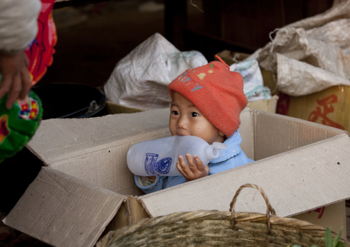 Kid in a market, Muang sing, Laos