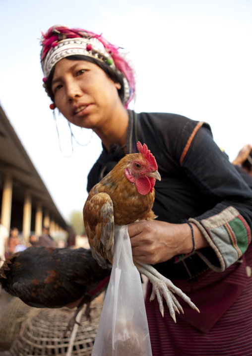 Akha minority woman with traditional headdress, Muang sing, Laos