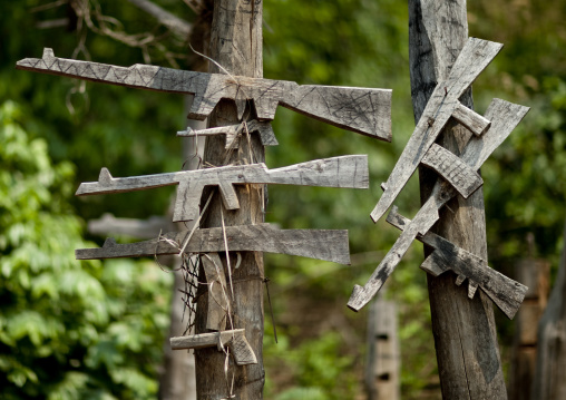 Wood kalshnikovs at akha village entrance, Ban ta mi, Laos