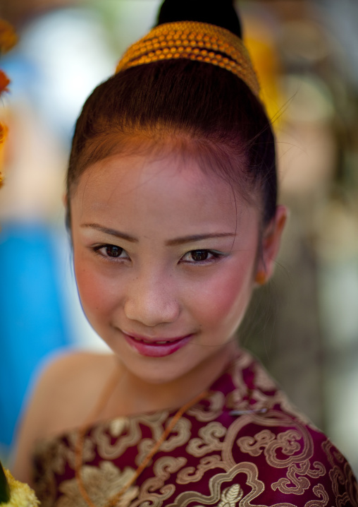 Girl in traditional clothing during pii mai lao new year celebration, Luang prabang, Laos