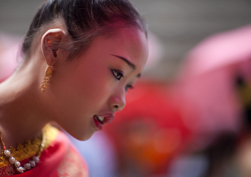 Girl in traditional clothing during pii mai lao new year celebration, Luang prabang, Laos