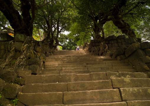 People climbing stairs at wat phu khmer temple, Champasak, Laos