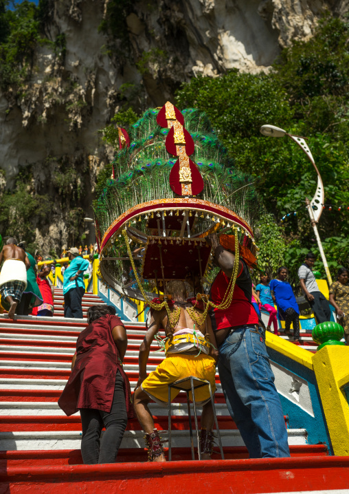 Devotee Kavadi Bearer Climbing Stairs At Thaipusam Hindu Religious Festival In Batu Caves, Southeast Asia, Kuala Lumpur, Malaysia