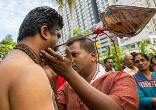 Hindu Devotee With Pierced Tongue During Annual Thaipusam Religious Festival In Batu Caves, Southeast Asia, Kuala Lumpur, Malaysia