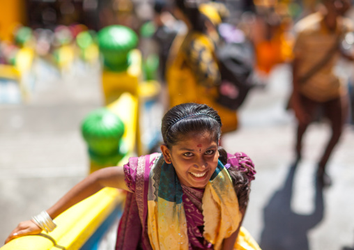 Smiling Woman Climbing Stairs In Batu Caves In Annual Thaipusam Religious Festival, Southeast Asia, Kuala Lumpur, Malaysia