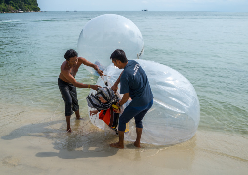 Muslim Tourist Inside A Water Walking Ball On Monkey Beach In Nan National Park, Penang Island, George Town, Malaysia